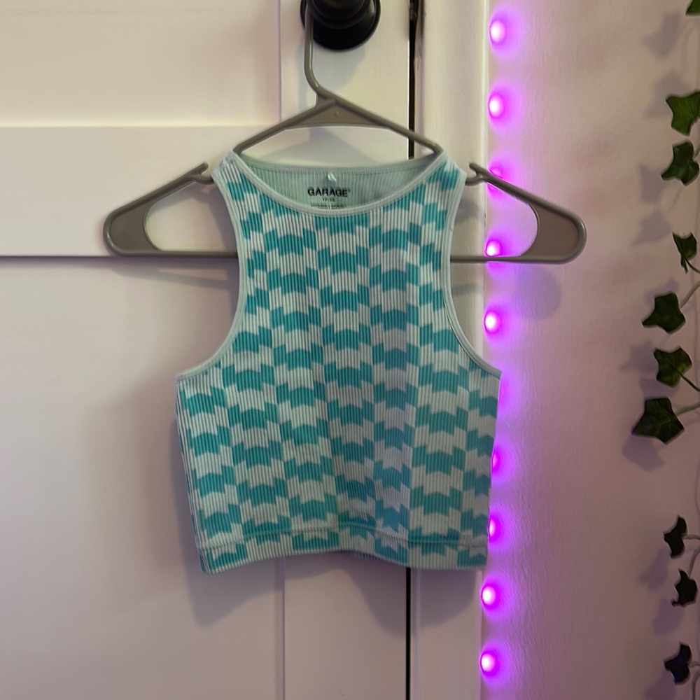 This tank top is from garage. It is a size XS. It has a unique pattern to it